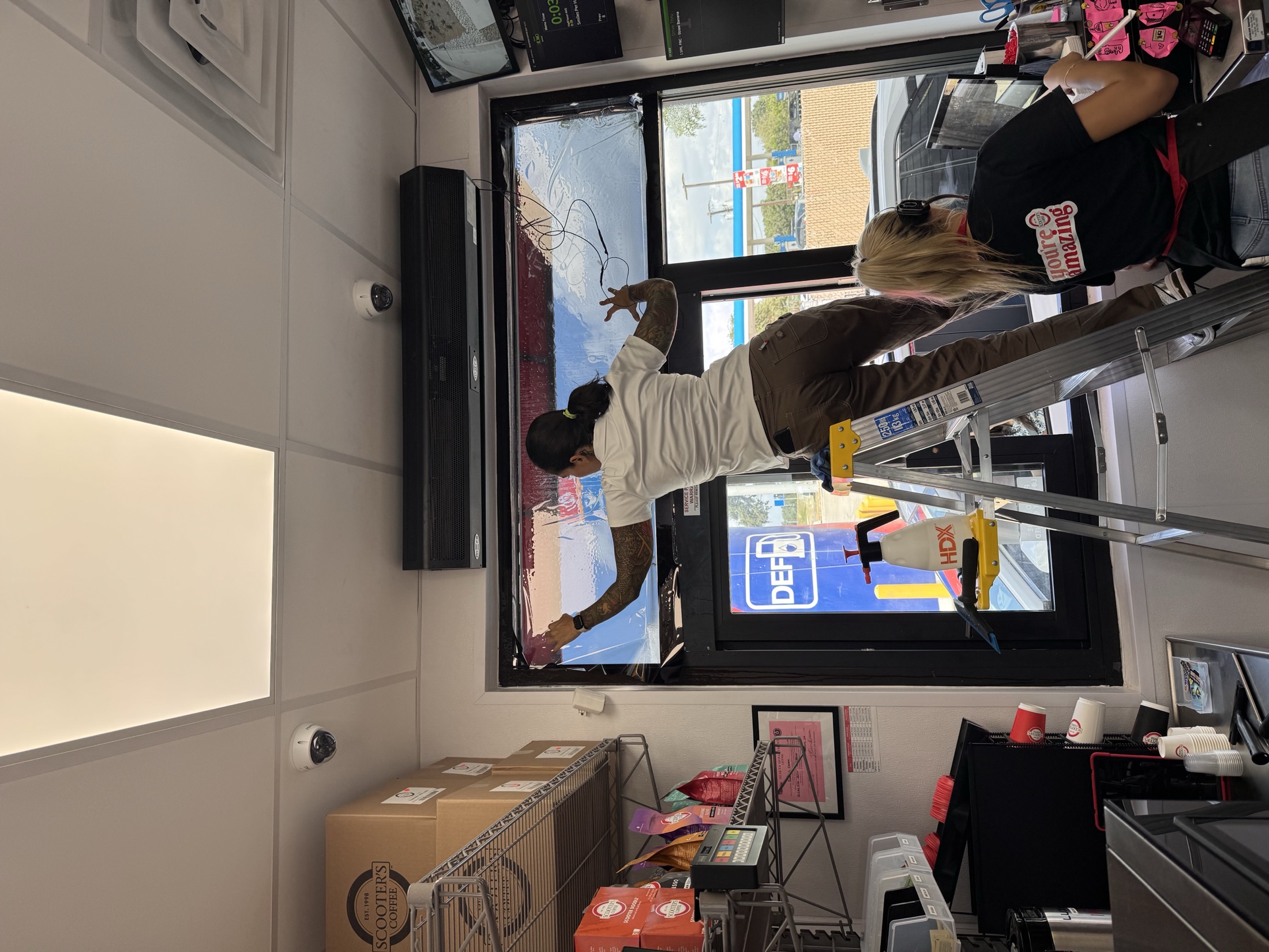 Professional window film installation in progress