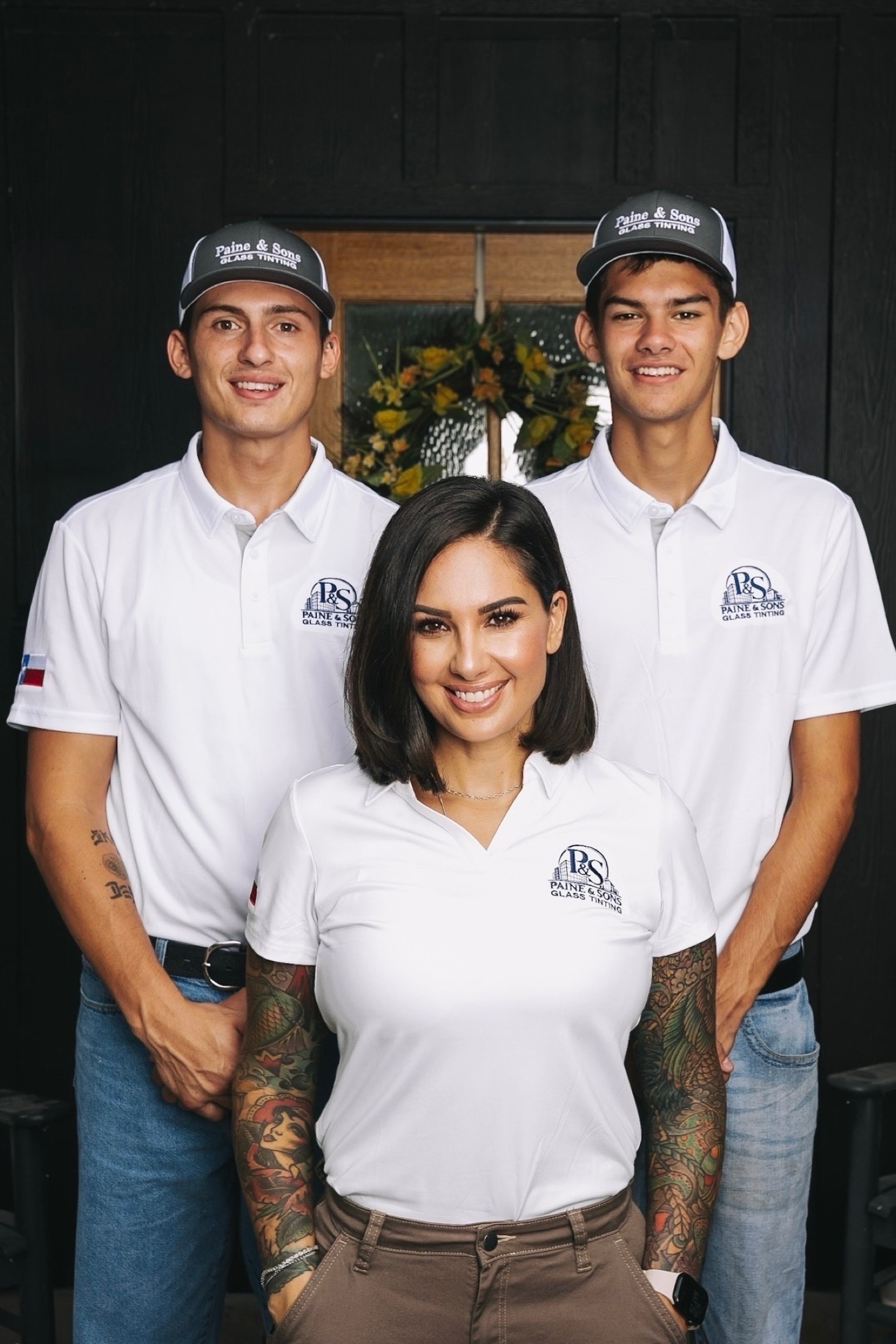 The Paine and Sons family team in company uniforms